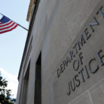 Signage is seen at the United States Department of Justice headquarters in Washington, D.C., U.S., August 29, 2020. REUTERS/Andrew Kelly