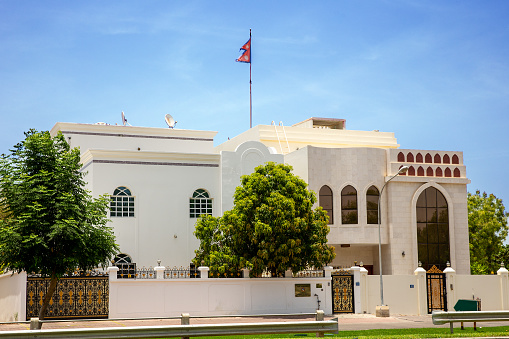 Inscription in Arabic reads: Embassy of the Republic of Nepal. Building of Embassy of Republic of Somalia in the city of Muscat. Sultanate of Oman