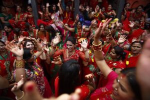 Women sing and dance at Pashupatinath Temple during the Teej festival in Kathmandu
